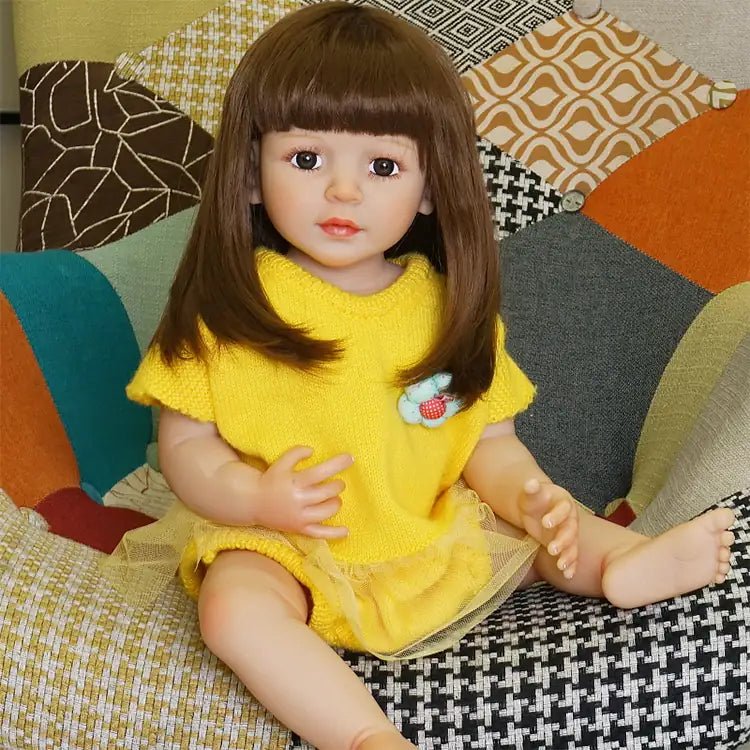 playful toddler doll in a yellow outfit with long hair - chimidoll