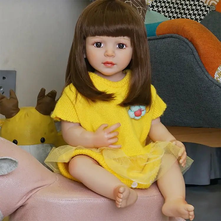 playful toddler doll in a yellow outfit with long hair - chimidoll