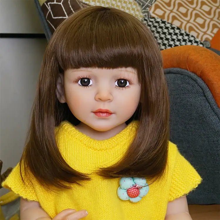 playful toddler doll in a yellow outfit with long hair - chimidoll