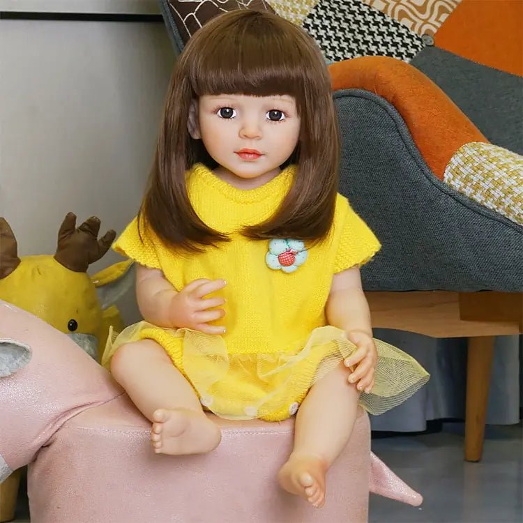 playful toddler doll in a yellow outfit with long hair - chimidoll