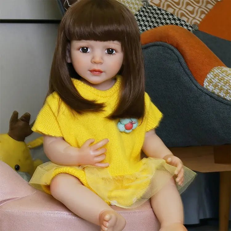 playful toddler doll in a yellow outfit with long hair - chimidoll