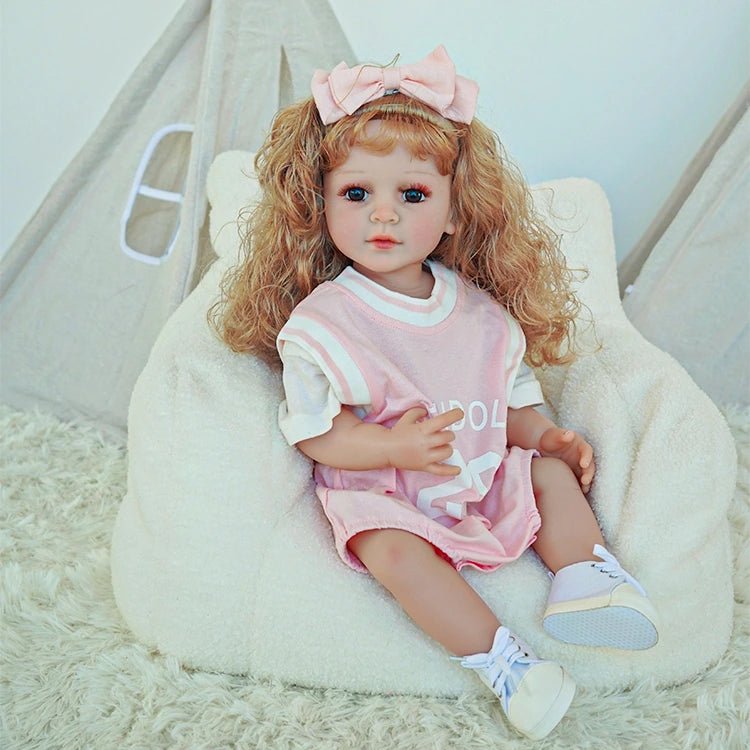 reborn toddler doll, curly hair wearing a pink basketball jersey - chimidoll
