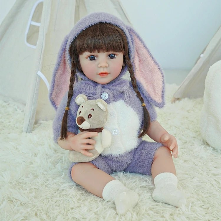 lifelike toddler doll with a purple bunny outfit and black long hair - chimidoll
