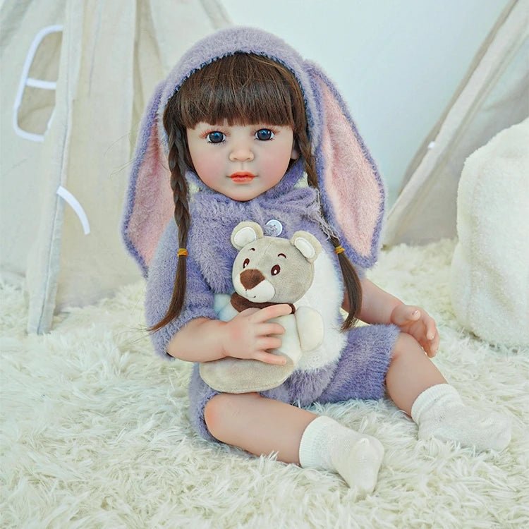 lifelike toddler doll with a purple bunny outfit and black long hair - chimidoll