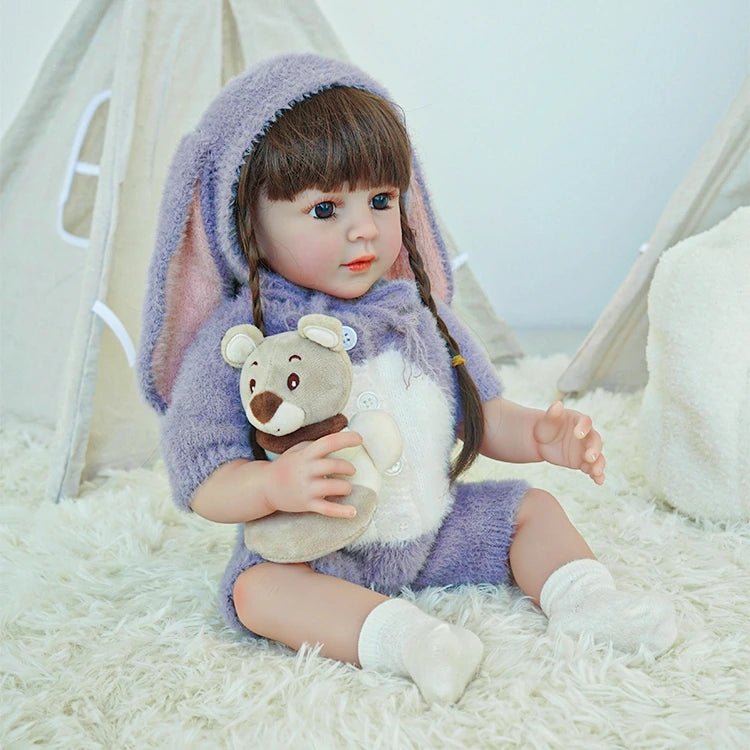 lifelike toddler doll with a purple bunny outfit and black long hair - chimidoll