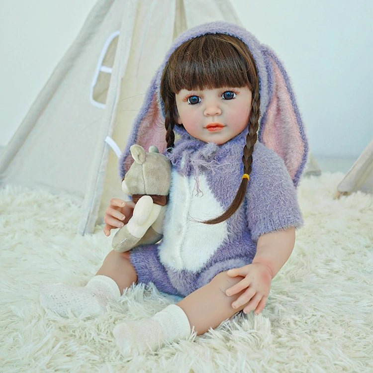 lifelike toddler doll with a purple bunny outfit and black long hair - chimidoll