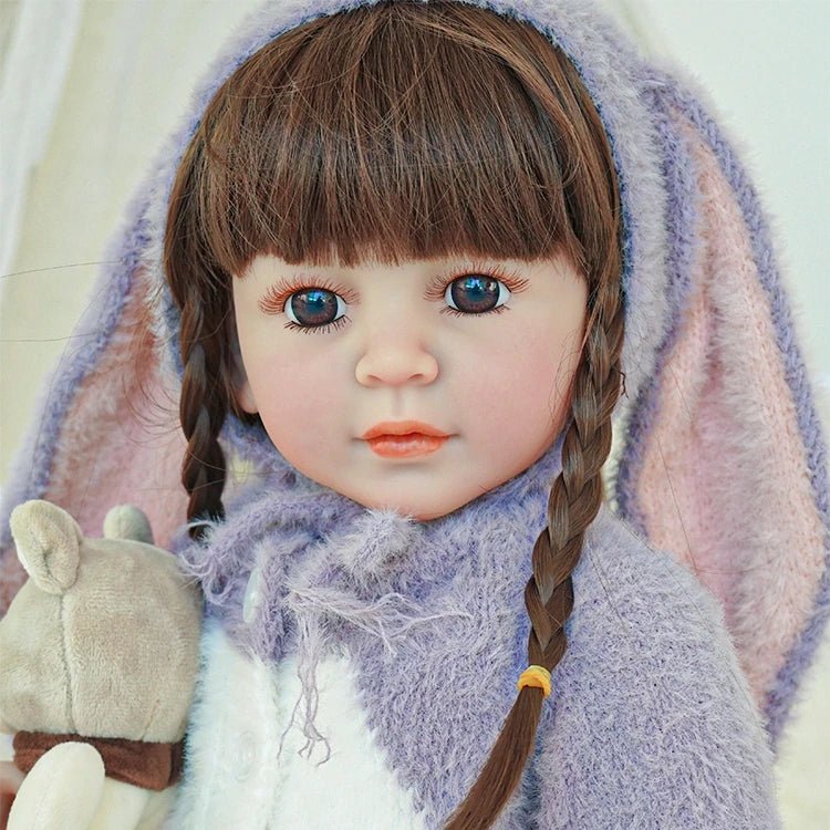 lifelike toddler doll with a purple bunny outfit and black long hair - chimidoll