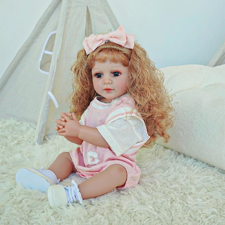 reborn toddler doll, curly hair wearing a pink basketball jersey - chimidoll