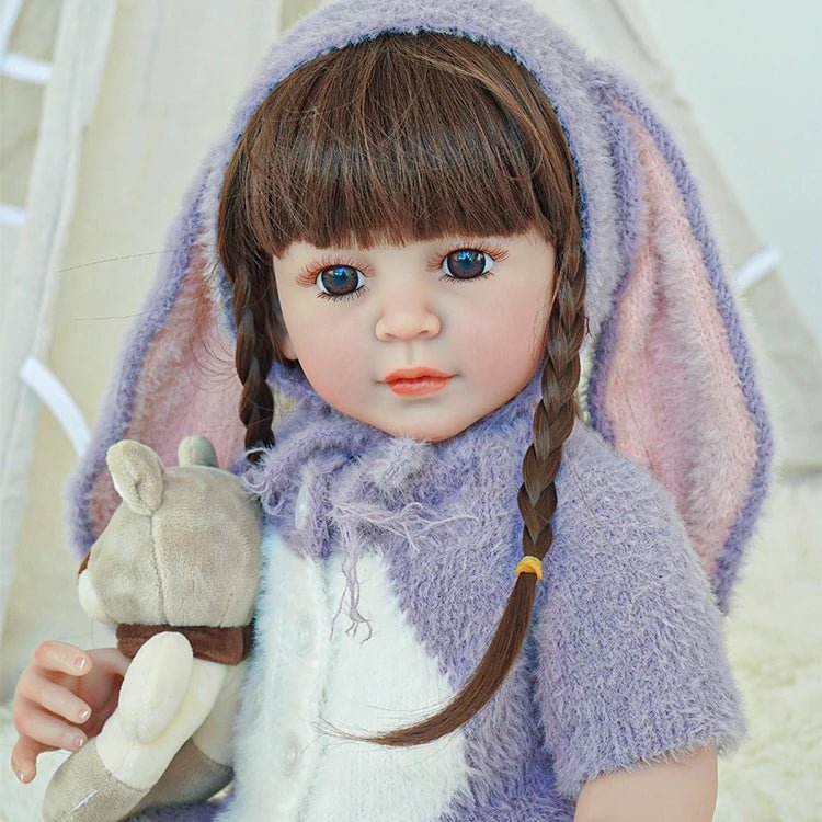 lifelike toddler doll with a purple bunny outfit and black long hair - chimidoll