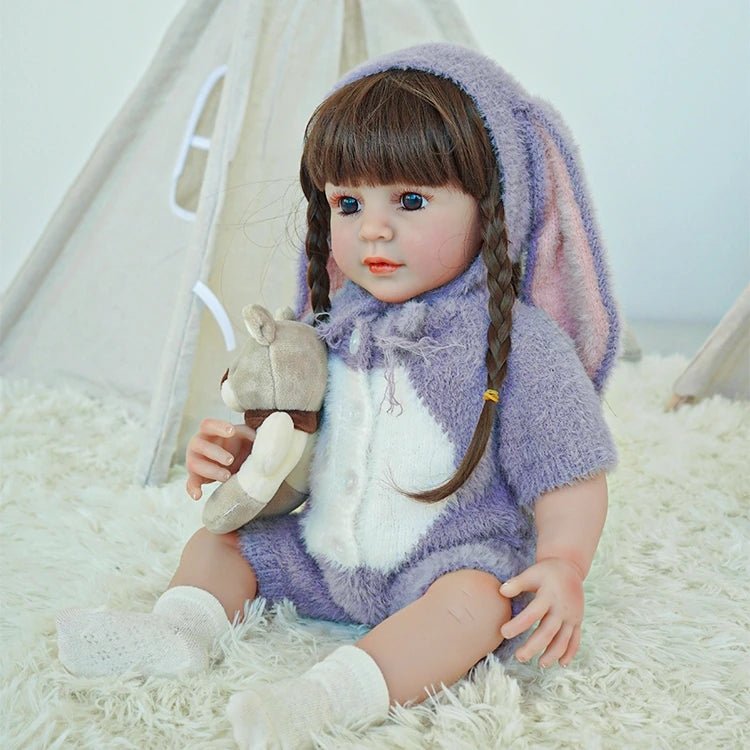 lifelike toddler doll with a purple bunny outfit and black long hair - chimidoll