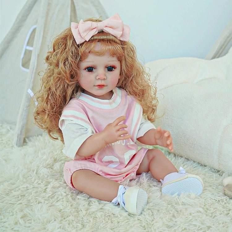 reborn toddler doll, curly hair wearing a pink basketball jersey - chimidoll