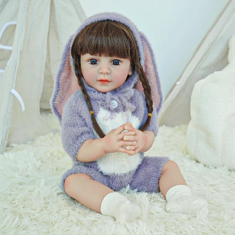lifelike toddler doll with a purple bunny outfit and black long hair - chimidoll