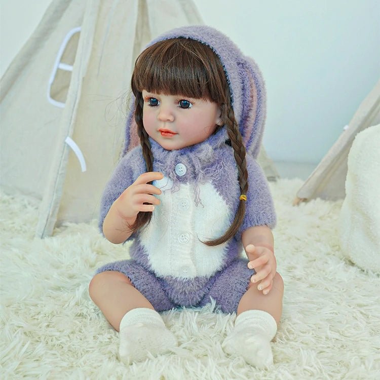 lifelike toddler doll with a purple bunny outfit and black long hair - chimidoll