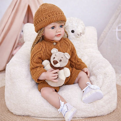 Chimidoll - encantadora muñeca de niño pequeño con atuendo castaño y cabello largo y amarillo.