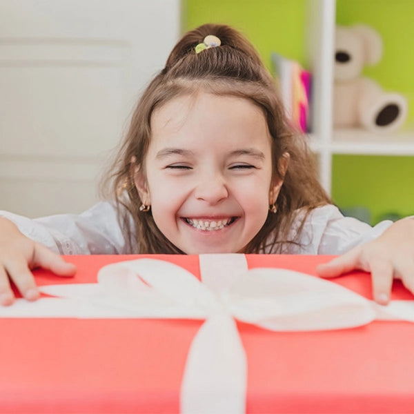 Little girl laughing at the gift