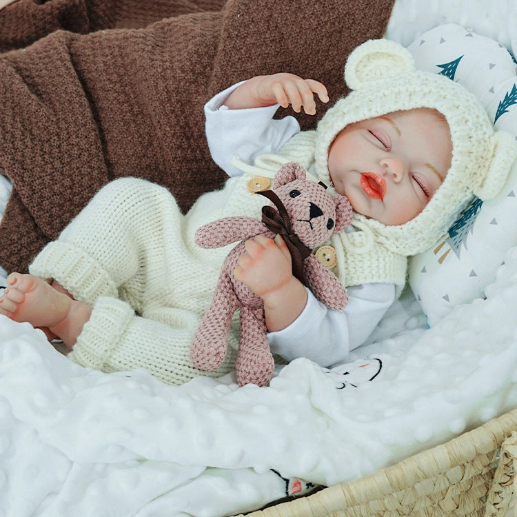 Ivory knit reborn doll clothes set with cotton suspenders overalls, white long-sleeve top and matching bonnet for 20-inch dolls, showcased on neutral grey background