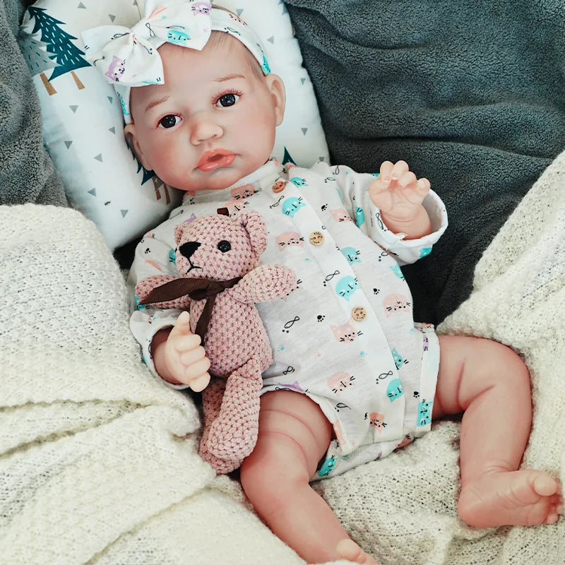 realistic baby doll | newborn dolls | life like baby dolls | soothing feel | hand-painted skin | weighted like a real baby | poseable limbs | premium quality | adorable outfit