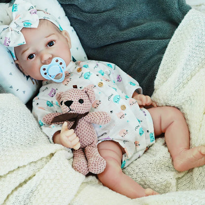 realistic baby doll | newborn dolls | life like baby dolls | soothing feel | hand-painted skin | weighted like a real baby | poseable limbs | premium quality | adorable outfit
