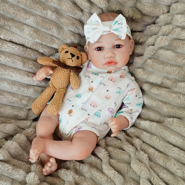 realistic baby doll | newborn dolls | life like baby dolls | soothing feel | hand-painted skin | weighted like a real baby | poseable limbs | premium quality | adorable outfit