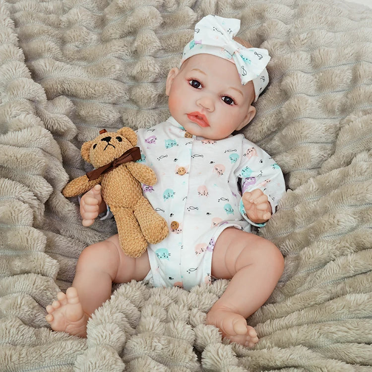 realistic baby doll | newborn dolls | life like baby dolls | soothing feel | hand-painted skin | weighted like a real baby | poseable limbs | premium quality | adorable outfit