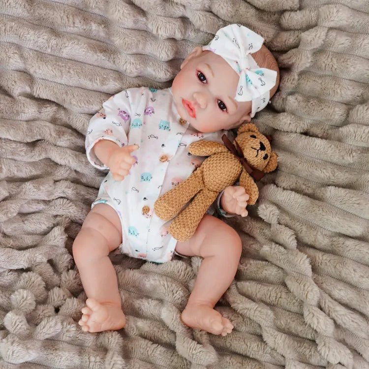 realistic baby doll | newborn dolls | life like baby dolls | soothing feel | hand-painted skin | weighted like a real baby | poseable limbs | premium quality | adorable outfit