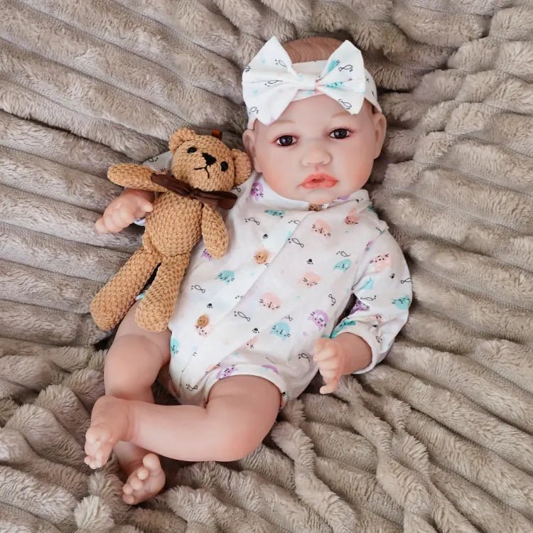 realistic baby doll | newborn dolls | life like baby dolls | soothing feel | hand-painted skin | weighted like a real baby | poseable limbs | premium quality | adorable outfit