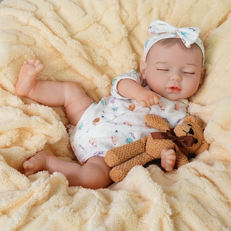 baby dolls | realistic baby dolls | sleeping reborn dolls | sleeping doll | squishy dolls | peaceful expression | soft and cuddly | delicate hand-painted features | gentle embrace | bedtime companion