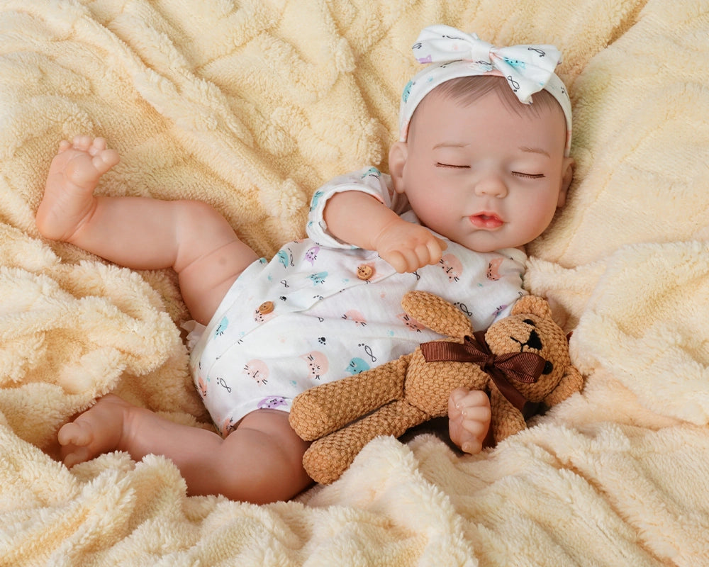 baby dolls | realistic baby dolls | sleeping reborn dolls | sleeping doll | squishy dolls | peaceful expression | soft and cuddly | delicate hand-painted features | gentle embrace | bedtime companion