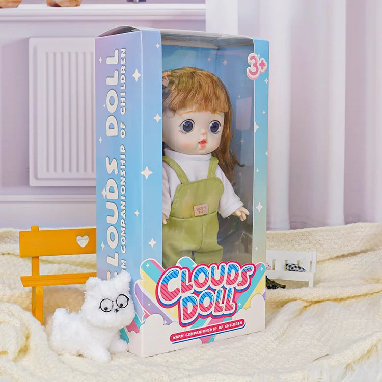 A charming doll with a cozy look, paired with a playful toy cat in glasses and a toy car on the side.